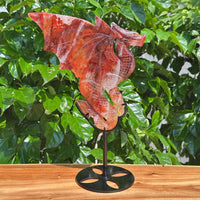 Fire Quartz Dragon Carving in natural light, emphasizing the vivid hues and fine craftsmanship of the dragon figure.