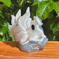 Detailed view of the Geode Agate Nine-Tailed Fox Carving with a translucent finish and stunning crystal features.