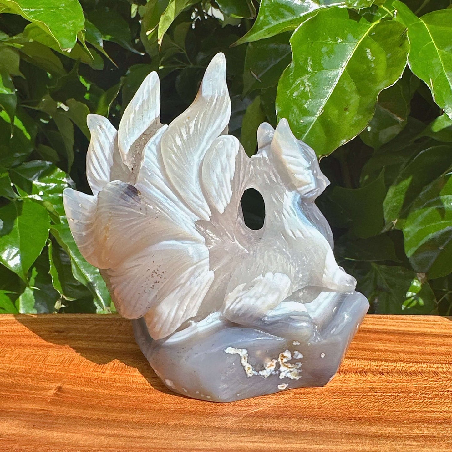Detailed view of the Geode Agate Nine-Tailed Fox Carving with a translucent finish and stunning crystal features.