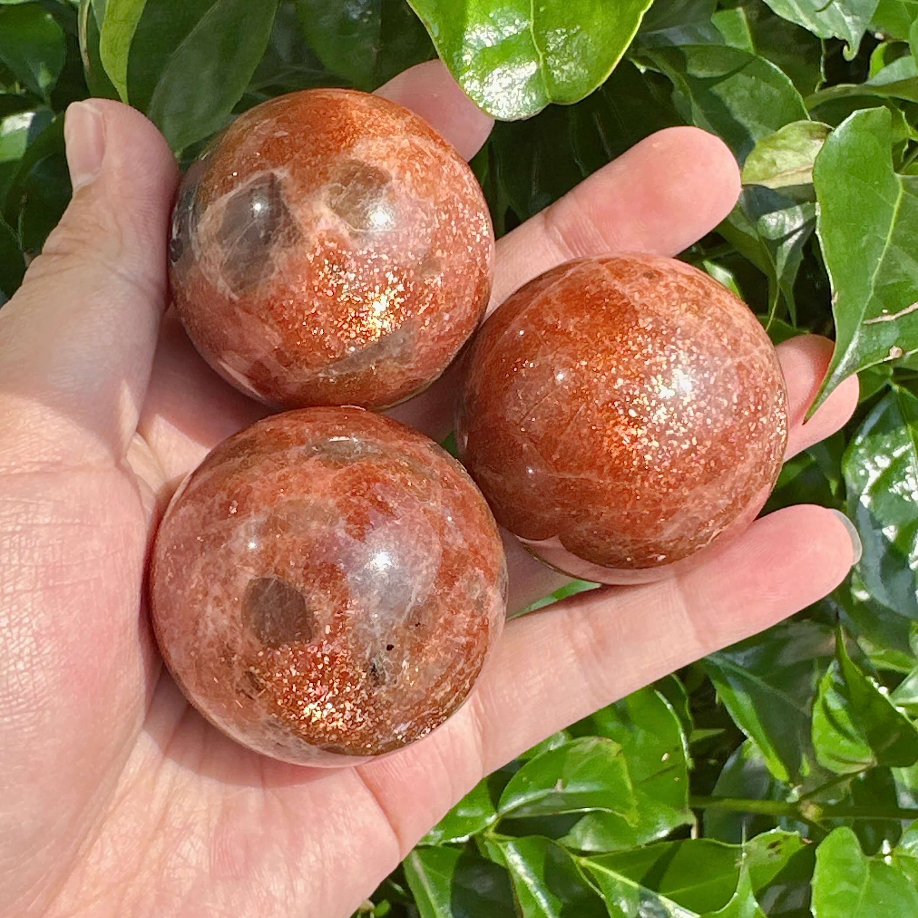 Golden Sunstone Sphere with radiant glow, showcasing vibrant orange and gold hues.