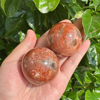 Beautiful Golden Sunstone Sphere, showcasing its intricate details and natural color variations.