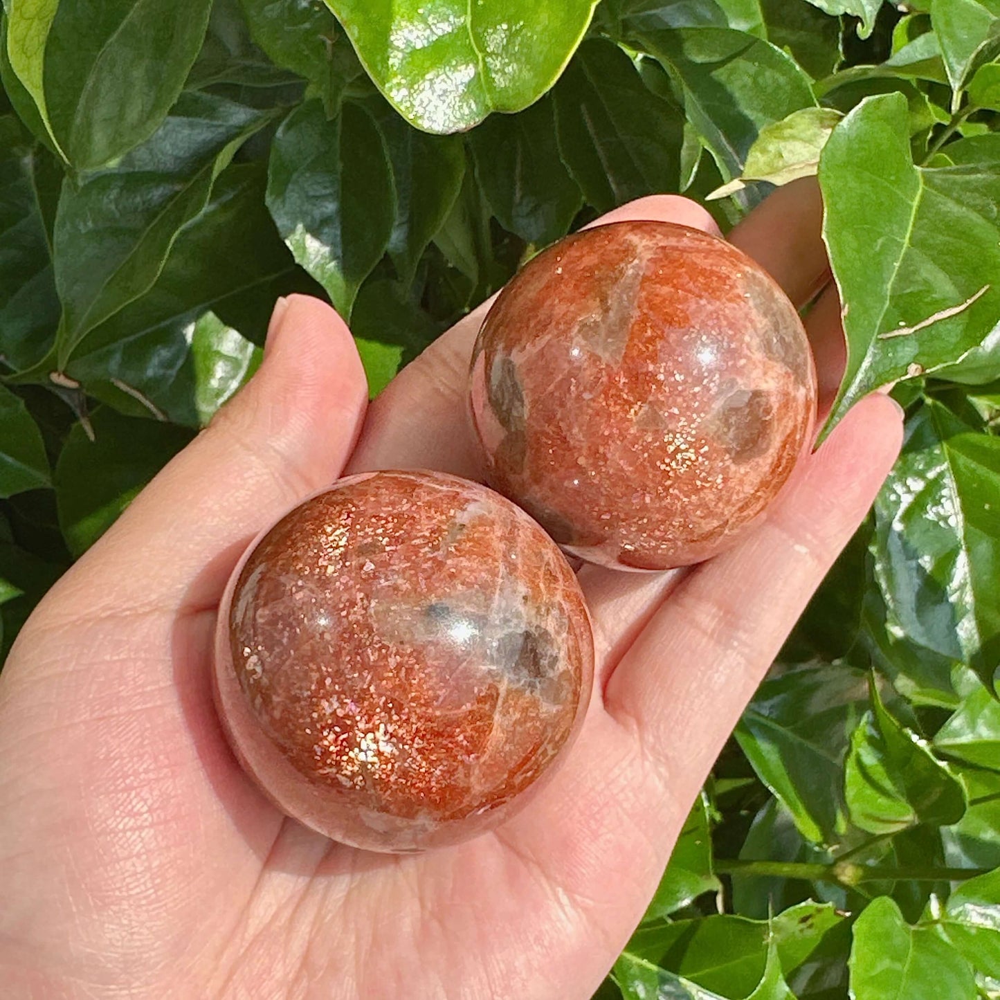 Beautiful Golden Sunstone Sphere, showcasing its intricate details and natural color variations.