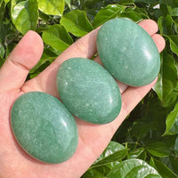 Polished Green Aventurine Palm Stone with a smooth and calming appearance.