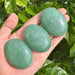 Polished Green Aventurine Palm Stone with a smooth and calming appearance.