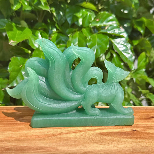 Green Strawberry Quartz Nine-Tailed Fox Carving showcasing intricate details and vibrant green hues.