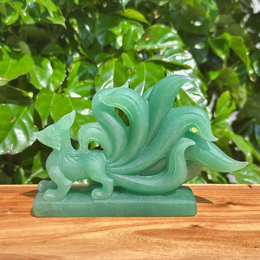 Close-up of Green Strawberry Quartz Nine-Tailed Fox Carving with fine detailing and beautiful color.