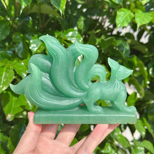 Green Strawberry Quartz Nine-Tailed Fox Carving capturing the delicate design and vibrant green tones.
