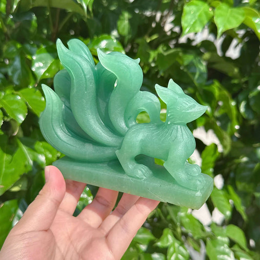 Close-up view of Green Strawberry Quartz Nine-Tailed Fox Carving showing intricate detail and unique structure.
