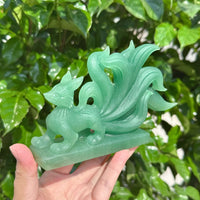 Green Strawberry Quartz Nine-Tailed Fox Carving with fine details and glowing green hues, perfect for any collection.
