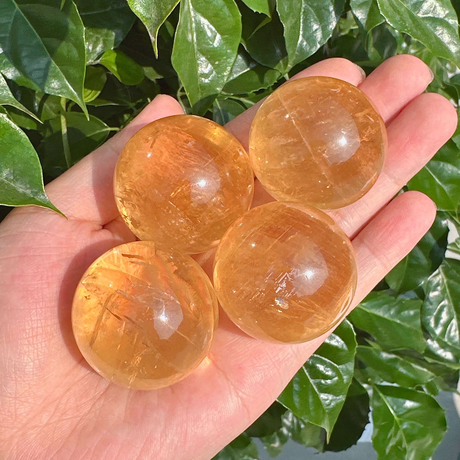Detailed view of Honey Calcite Sphere, showcasing its natural texture and crystalline beauty.