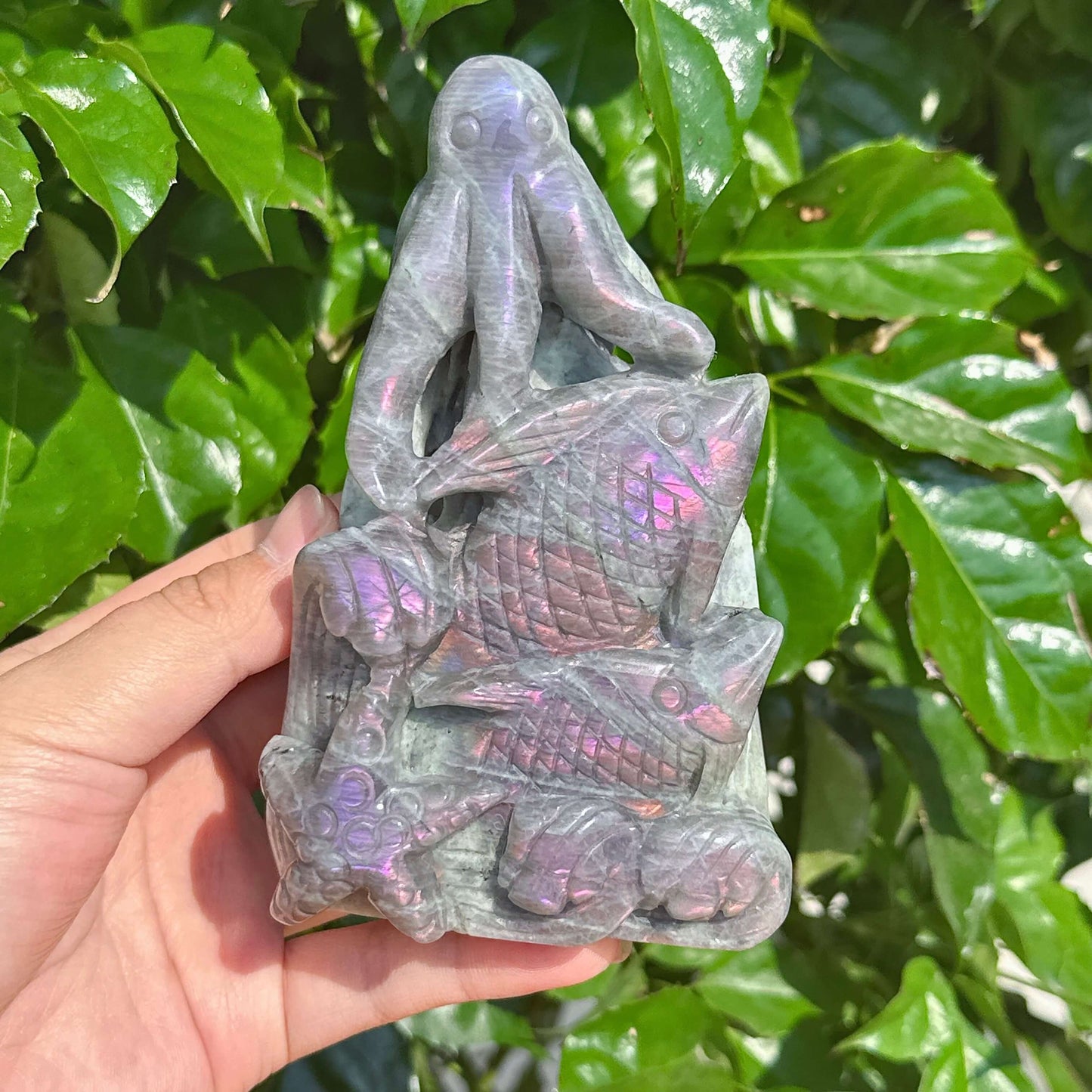 Close-up of the Labradorite octopus sculpture showcasing its unique gemstone reflections.