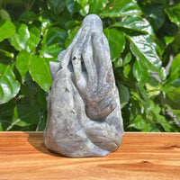 Labradorite octopus carving in a natural light setting, emphasizing the captivating colors and details.