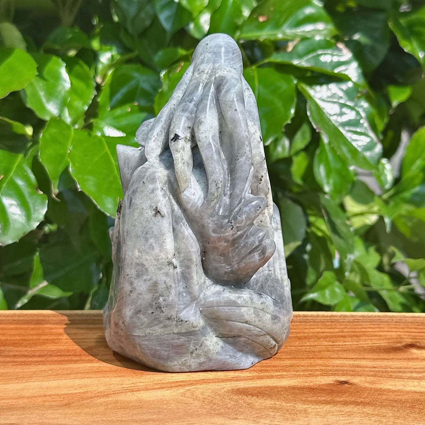 Labradorite octopus carving in a natural light setting, emphasizing the captivating colors and details.