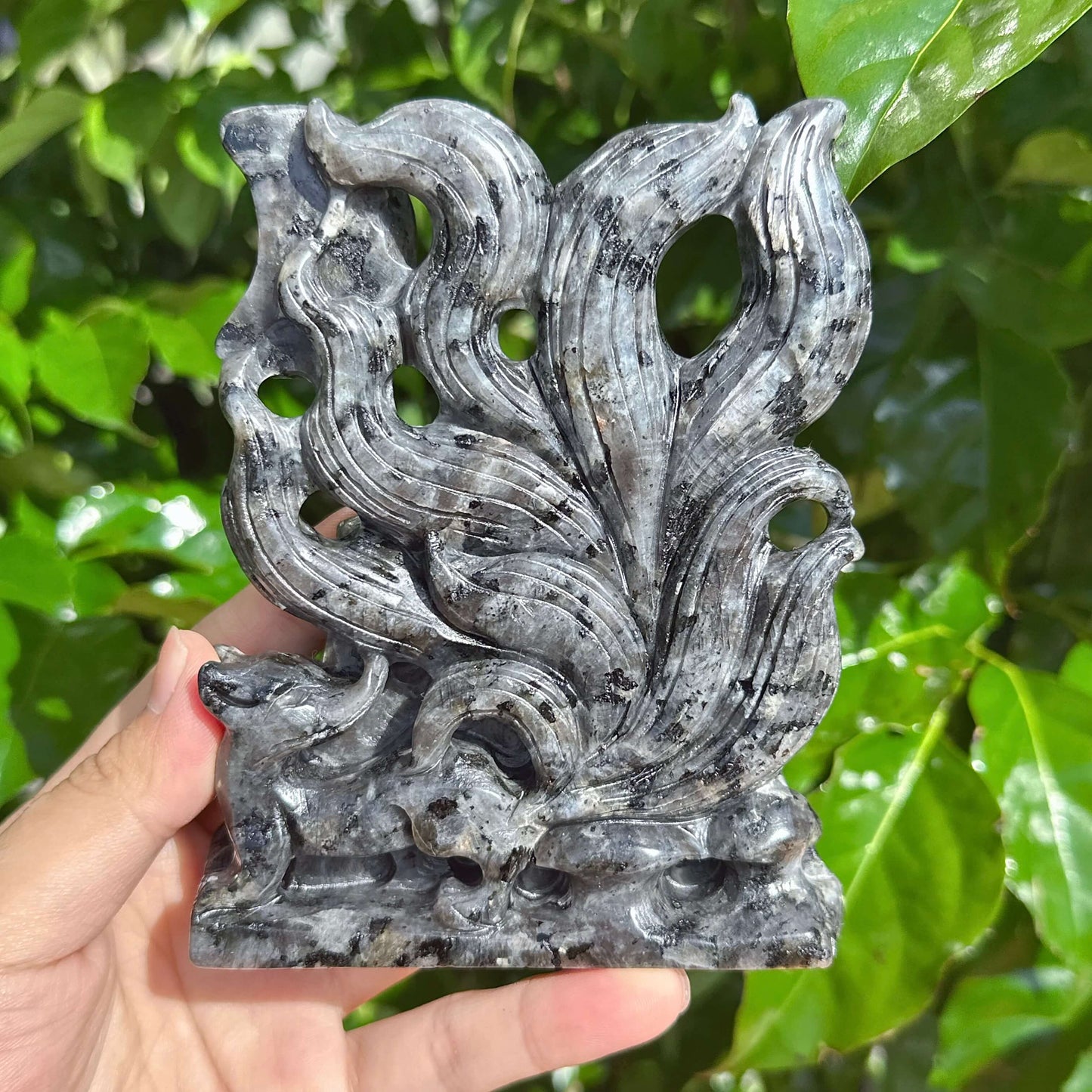 The Larvikaite Nine-Tailed Fox Carving, featuring a mystical fox with a detailed stone base.