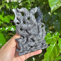 Larvikaite Nine-Tailed Fox Carving in vivid colors, capturing the stone’s natural patterns and fox design.