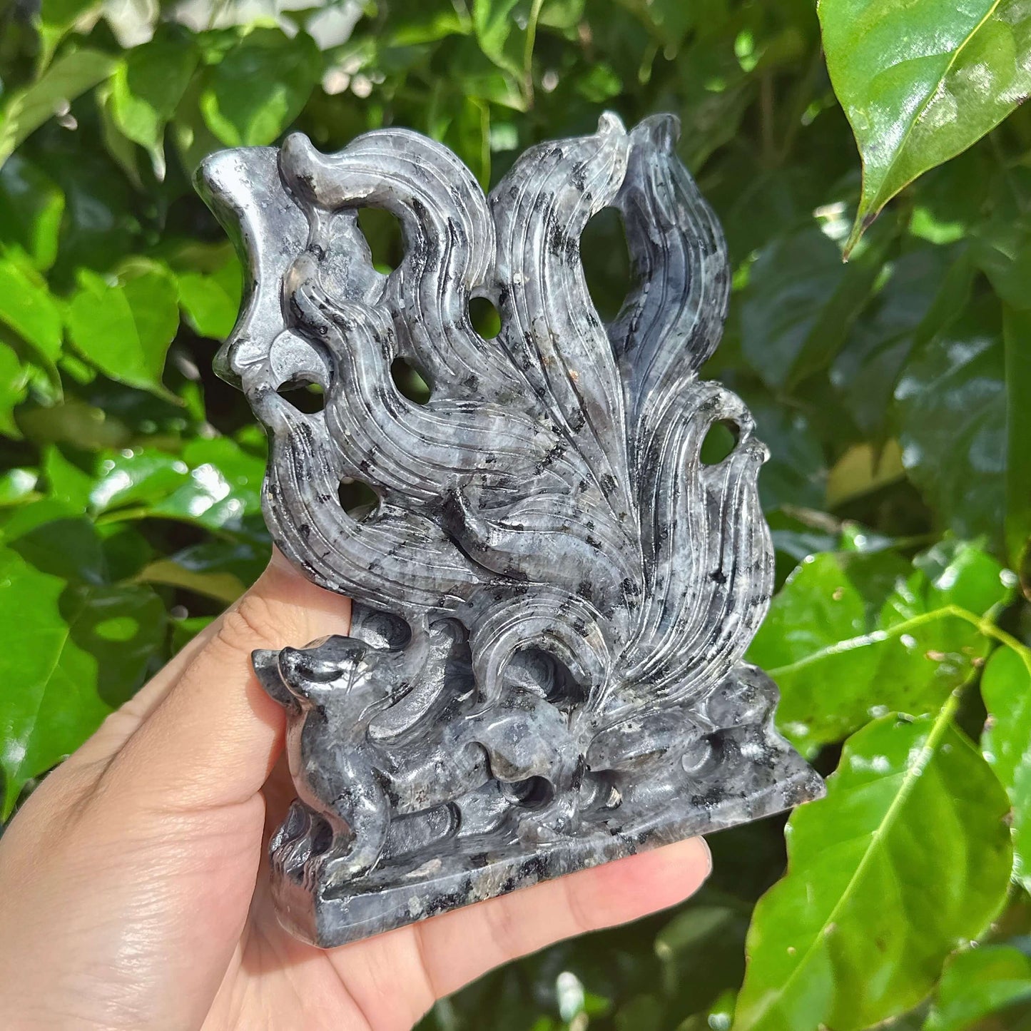 Larvikaite Nine-Tailed Fox Carving in vivid colors, capturing the stone’s natural patterns and fox design.