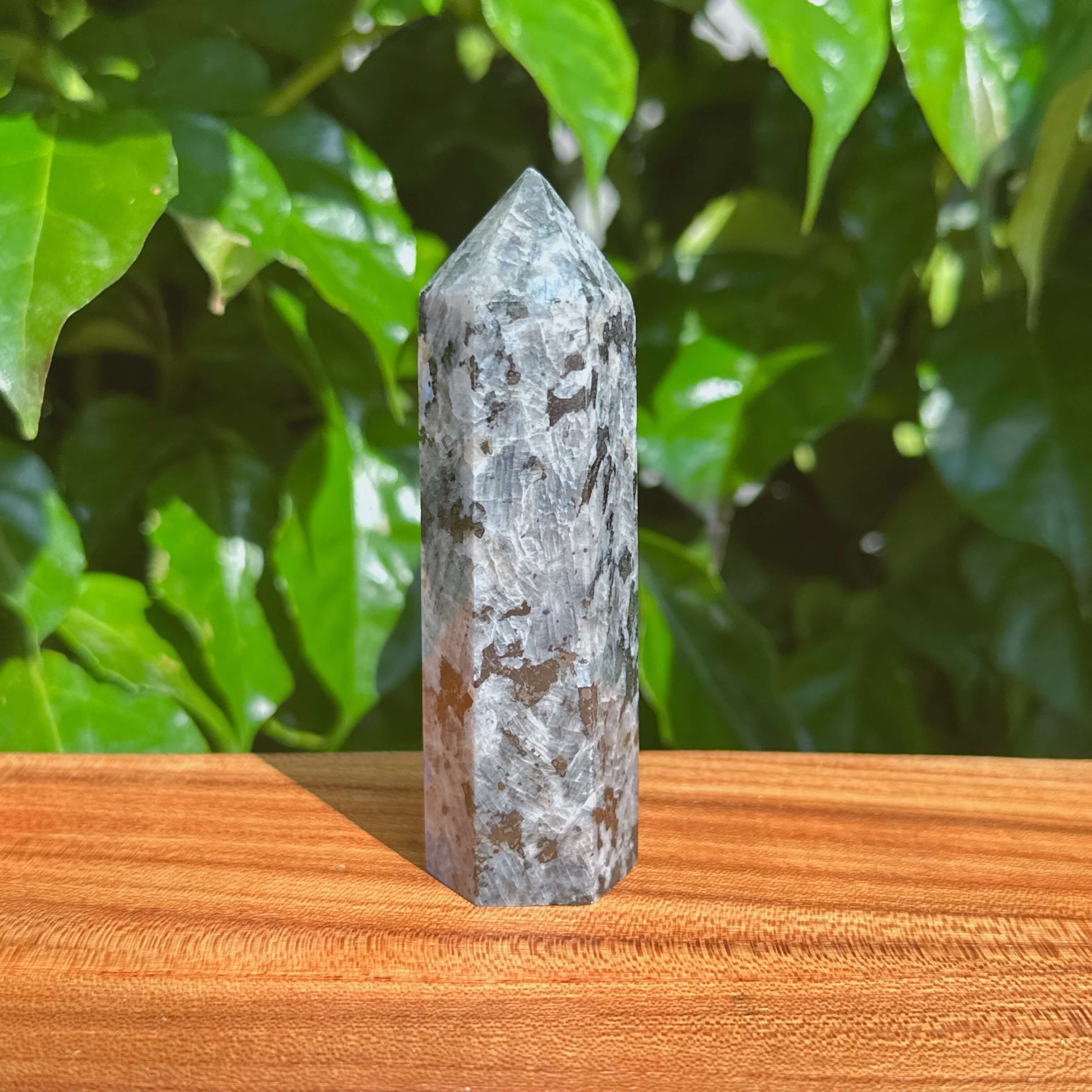 Close-up view of a Larvikite tower showcasing natural patterns and textures.