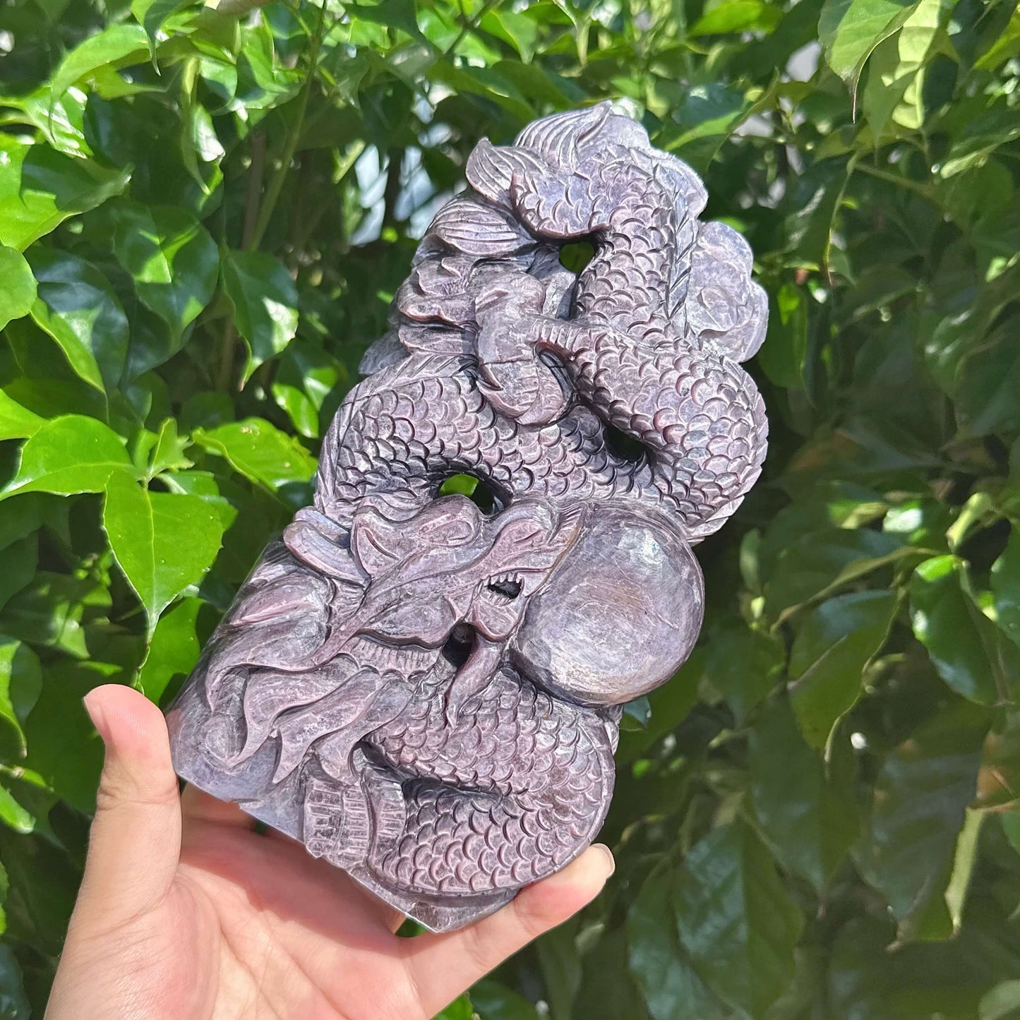 Dragon and crystal ball carved in Lepidolite, symbolizing power and harmony.