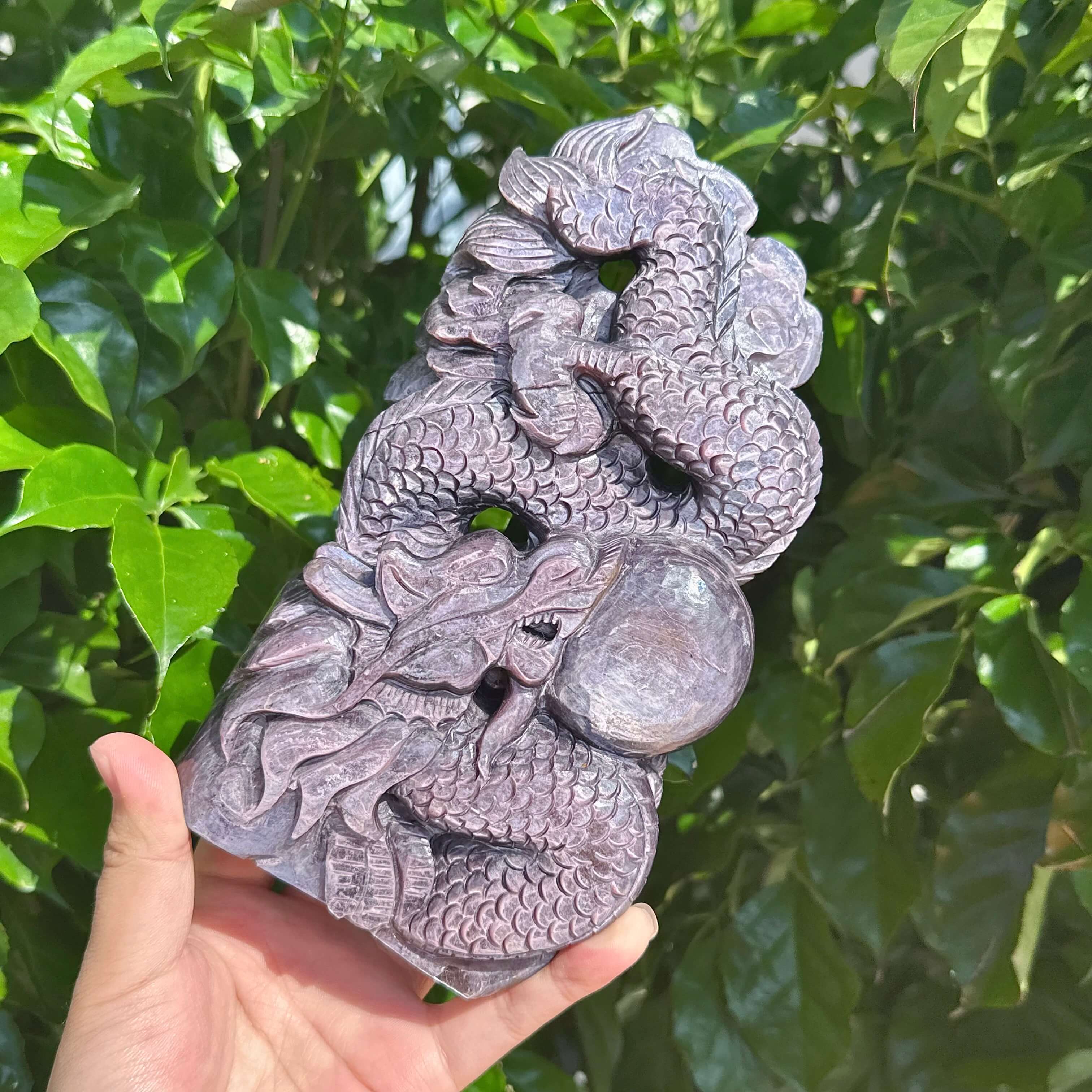 Dragon and crystal ball carved in Lepidolite, symbolizing power and harmony.