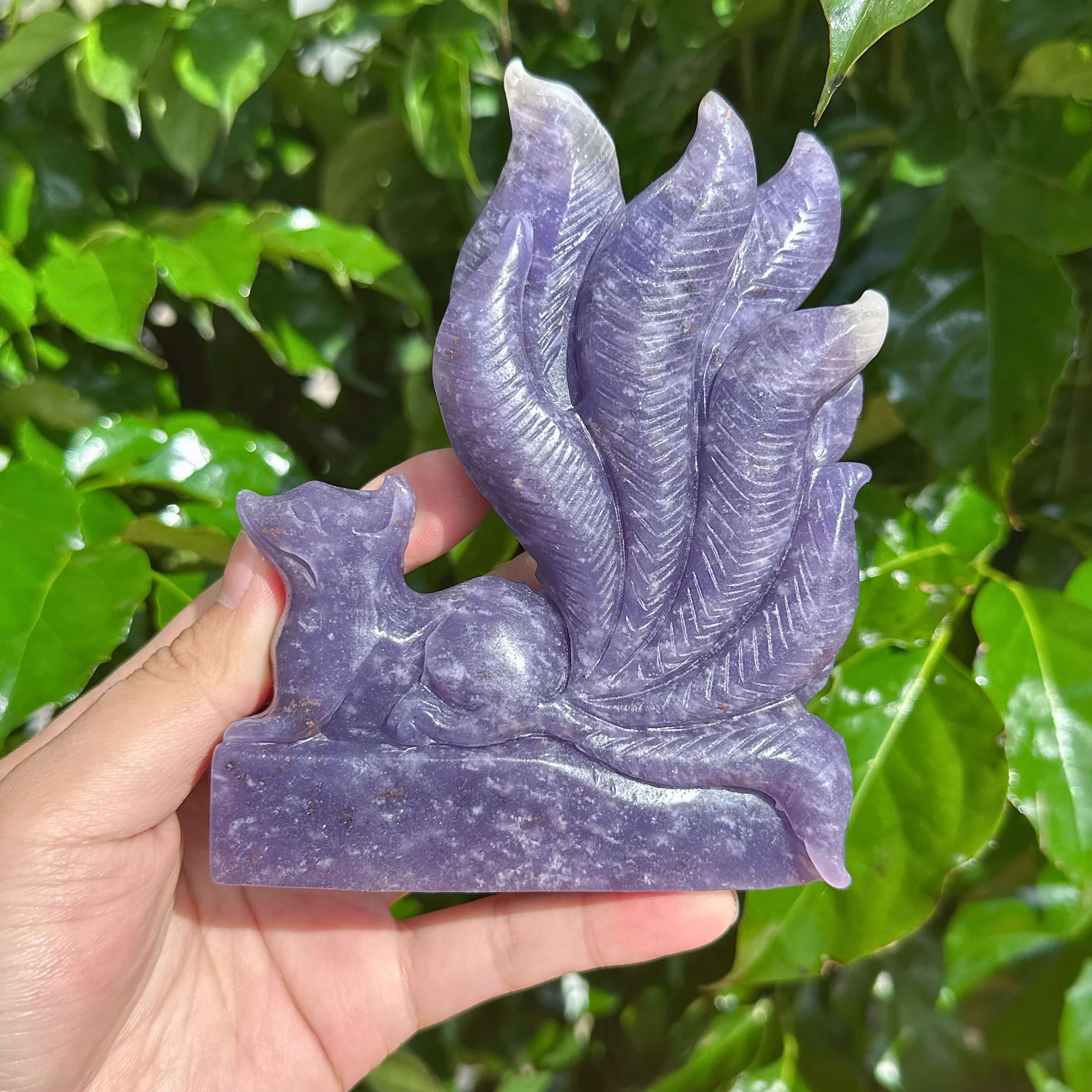 Detailed Lepidolite Nine-Tailed Fox sculpture showing the intricate tail and crystal texture.