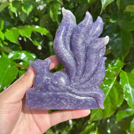 Detailed Lepidolite Nine-Tailed Fox sculpture showing the intricate tail and crystal texture.