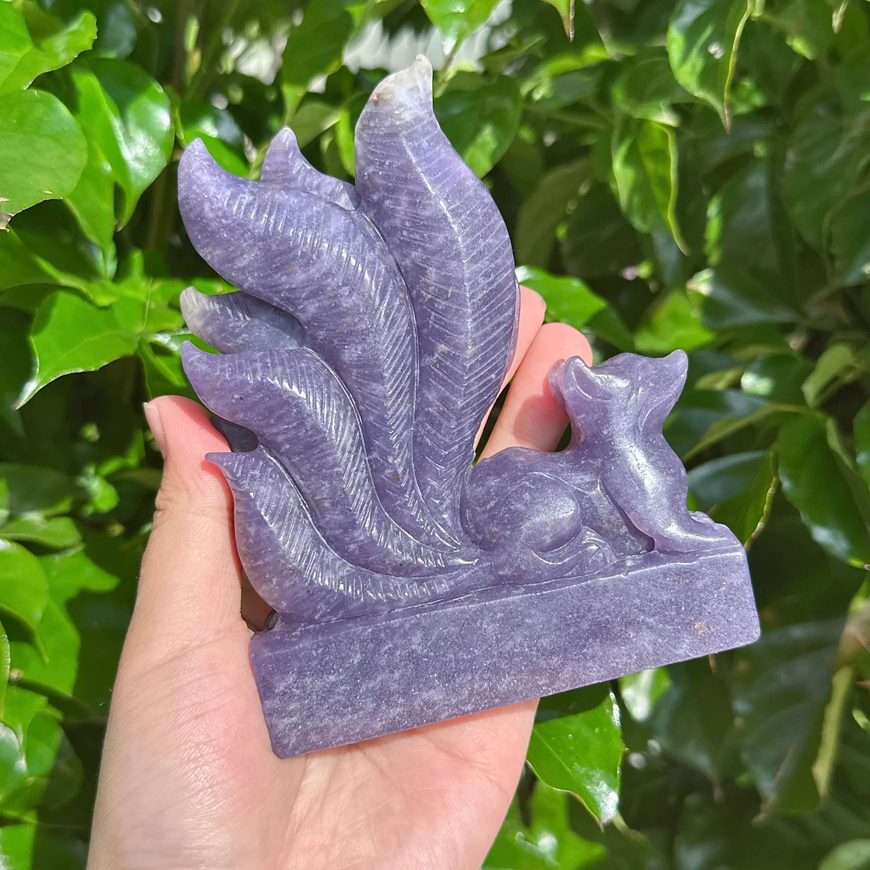 Close-up of the Lepidolite Nine-Tailed Fox Carving, showcasing the fine craftsmanship and crystal structure.