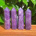 Lepidolite Tower showcasing its soothing purple hues and natural crystal formations, ideal for emotional healing.