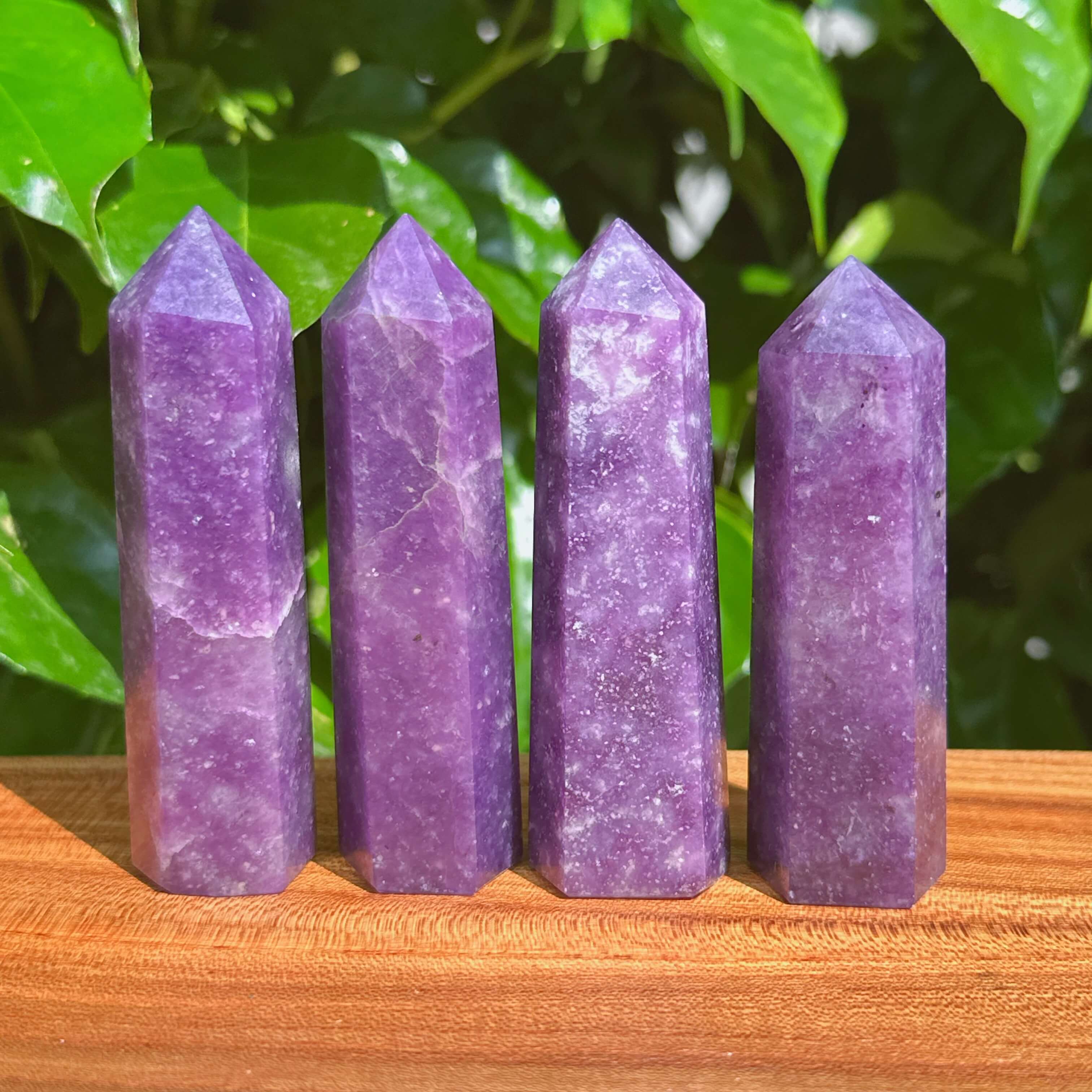 Lepidolite Tower showcasing its soothing purple hues and natural crystal formations, ideal for emotional healing.