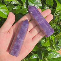 Close-up of a Lepidolite Tower, displaying its unique purple and white patterns, great for balancing emotions and promoting peace.