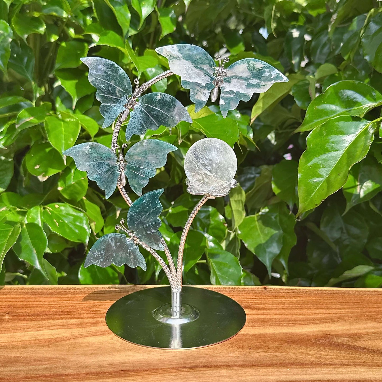 Elegant Moss Agate Butterfly Sphere Holder featuring a butterfly design and moss agate base.