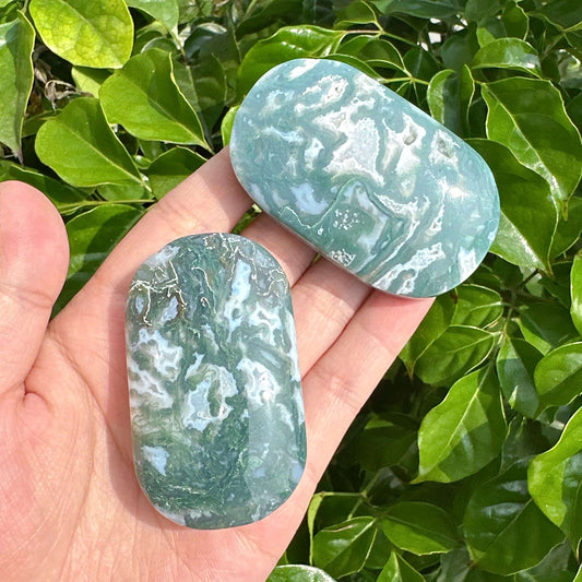 Beautiful Moss Agate Palm Stone with natural marbled green patterns, perfect for healing and decor.