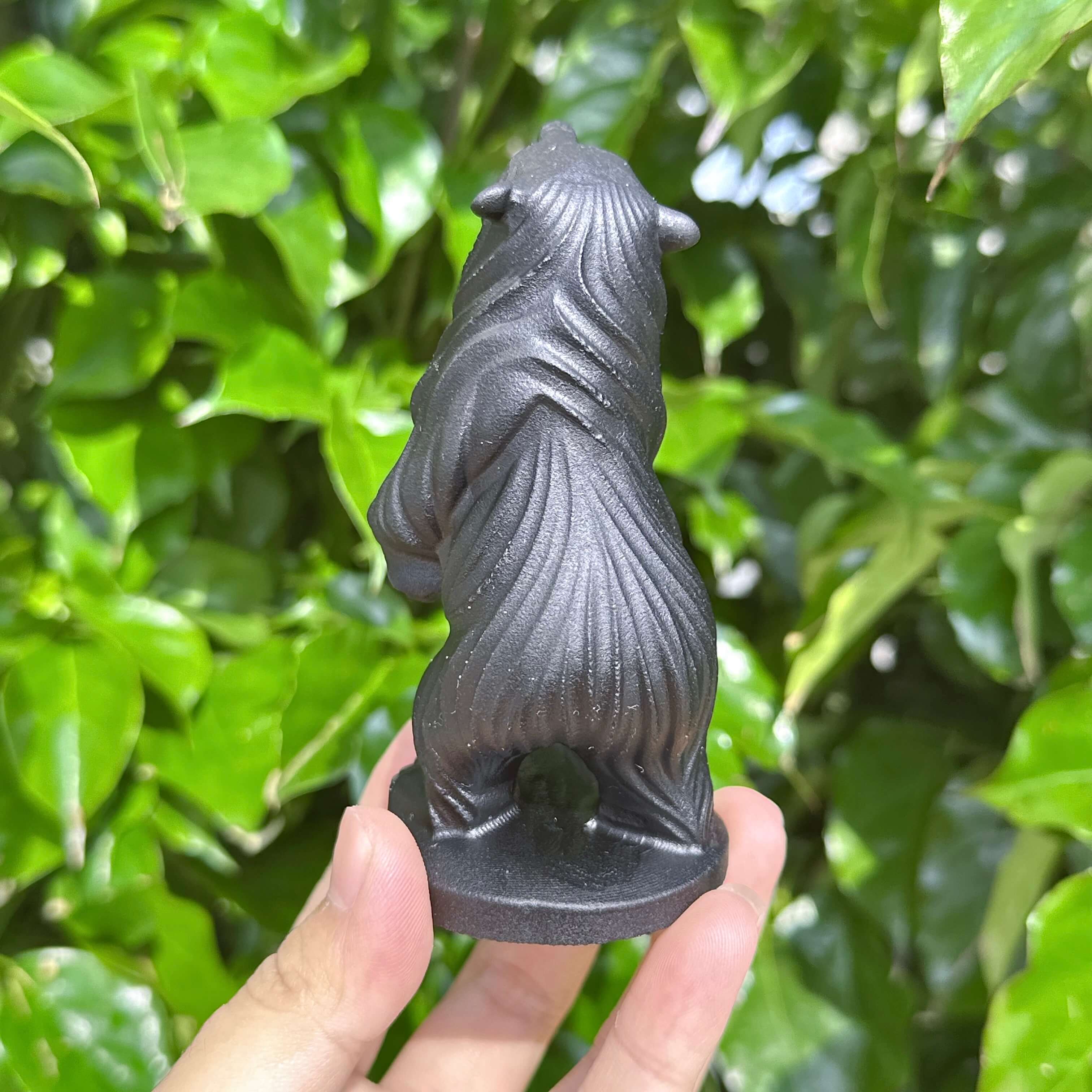 Full view of the Obsidian Capibara statue, showcasing its complete design with intricate details and polished finish.