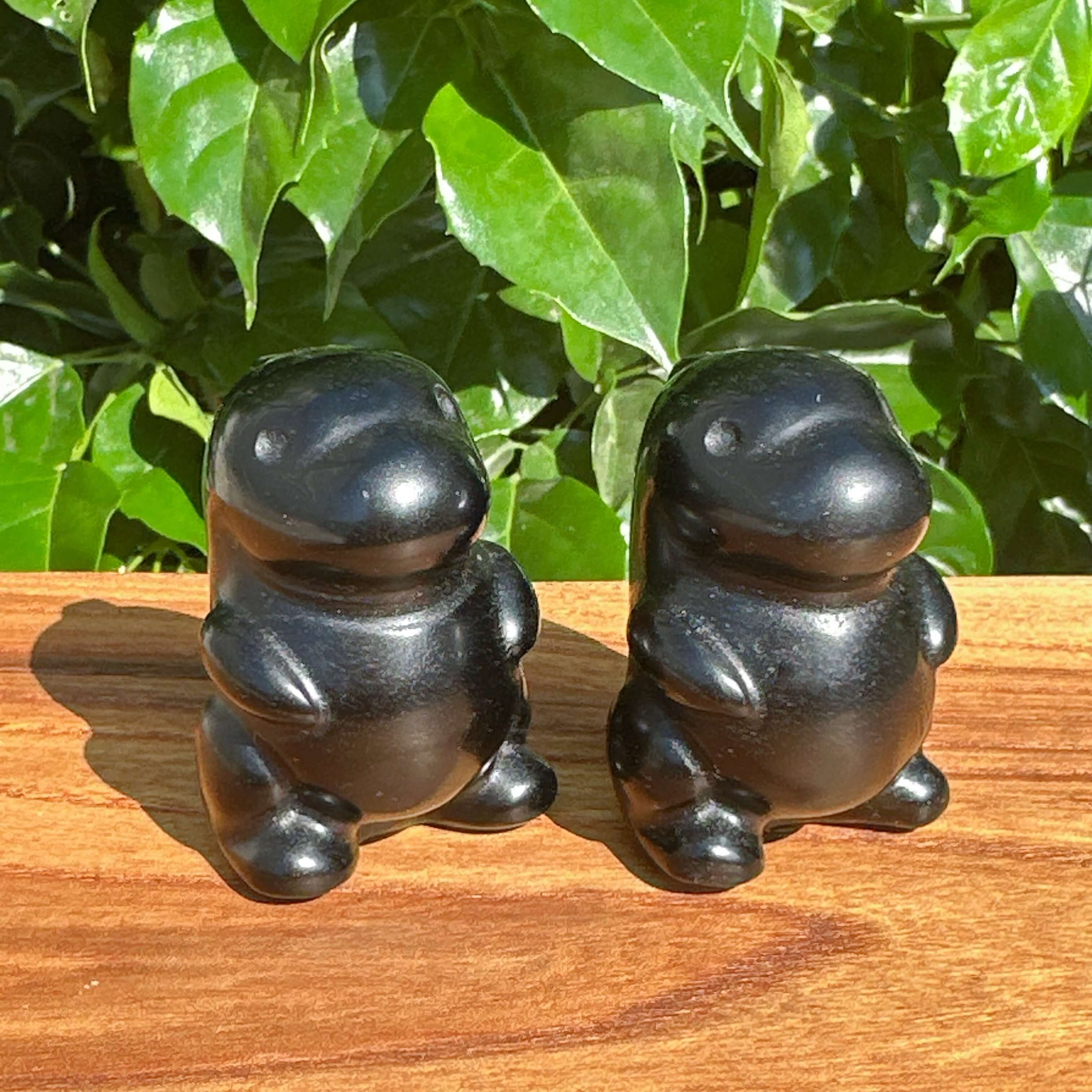 Obsidian Godzilla Carving showcasing detailed features of Godzilla with a sleek black finish and intricate carving details.