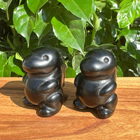 Side view of Obsidian Godzilla Carving, emphasizing the fine craftsmanship and polished black surface.