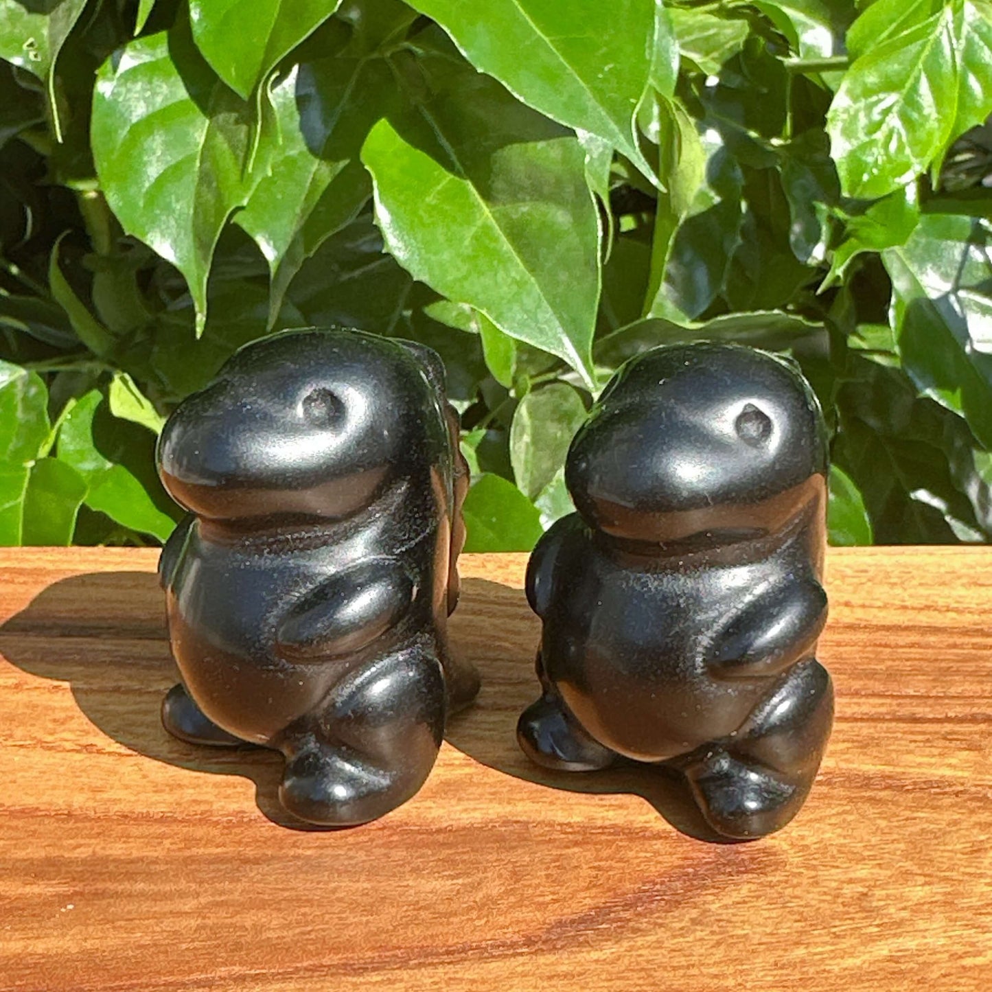Side view of Obsidian Godzilla Carving, emphasizing the fine craftsmanship and polished black surface.