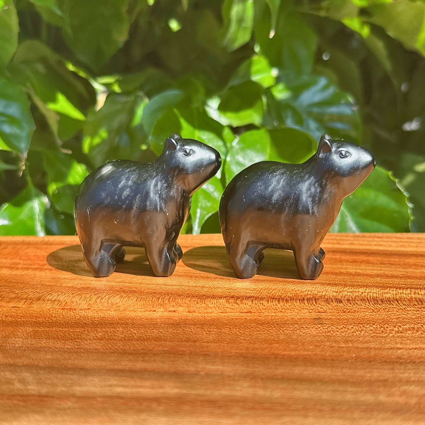 Handcrafted Obsidian Kapibala figurines with an intricate polished finish, perfect for collectors of gemstone art and spiritual decor.
