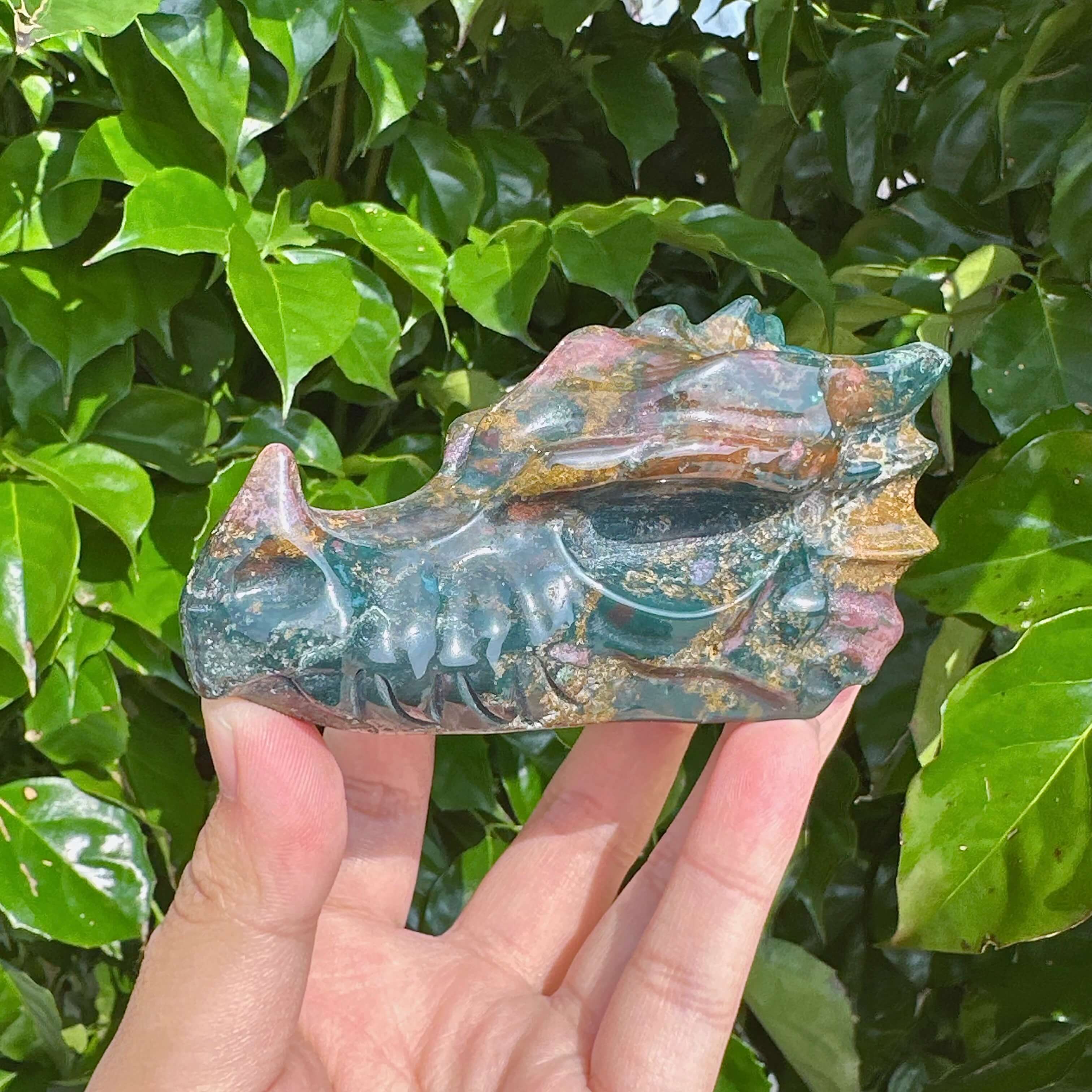 Ocean Jasper Dragon Head Carving with detailed textures and vibrant colors.