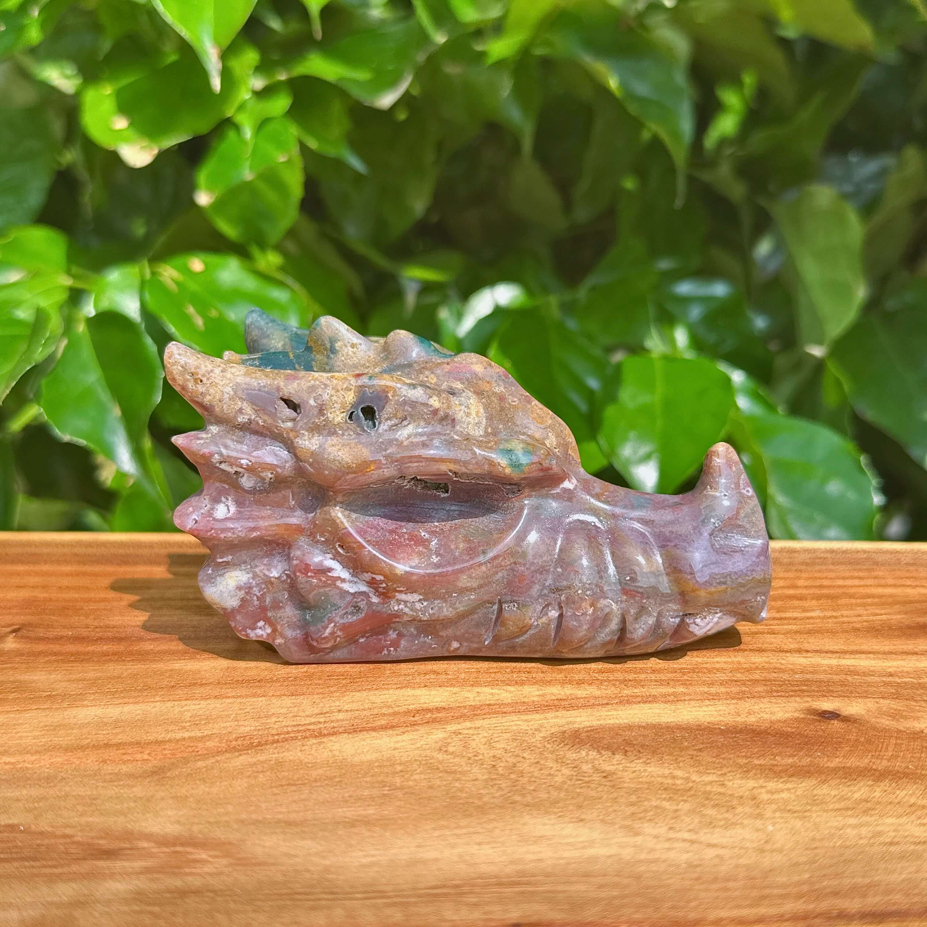 Close-up of Ocean Jasper Dragon Head Carving showcasing its fine craftsmanship and color gradient.