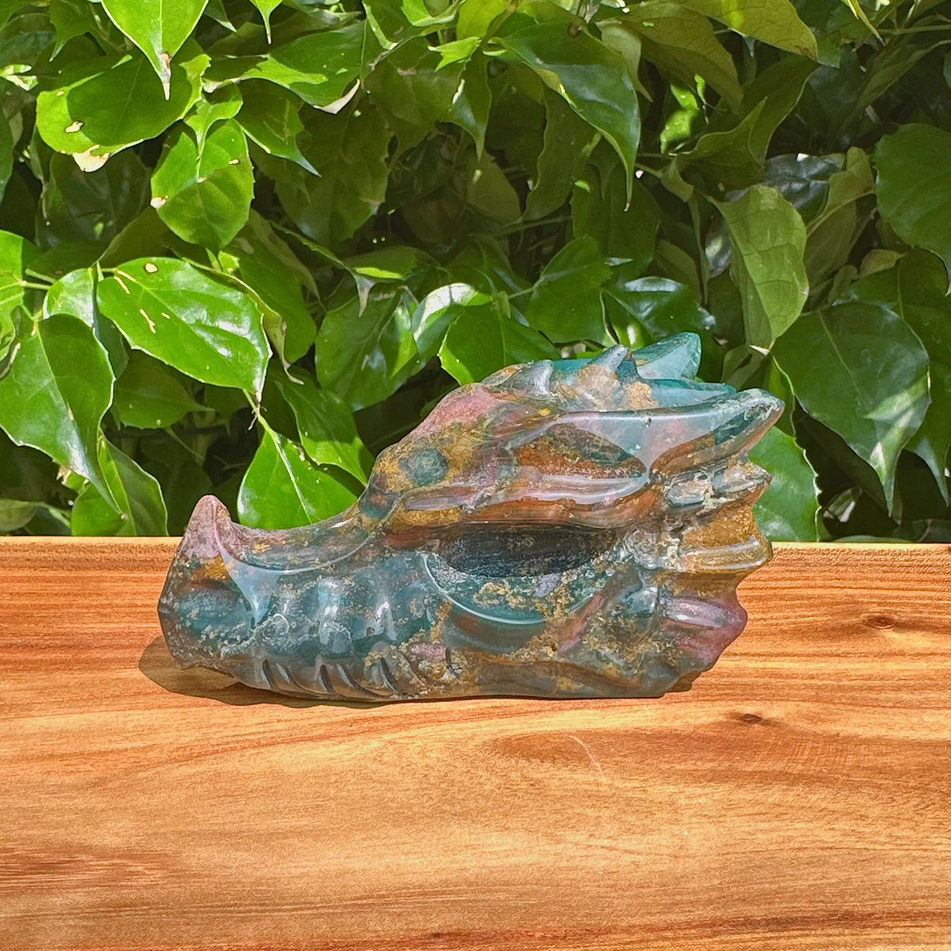Side profile of Ocean Jasper Dragon Head Carving highlighting its artistic form and stone texture.