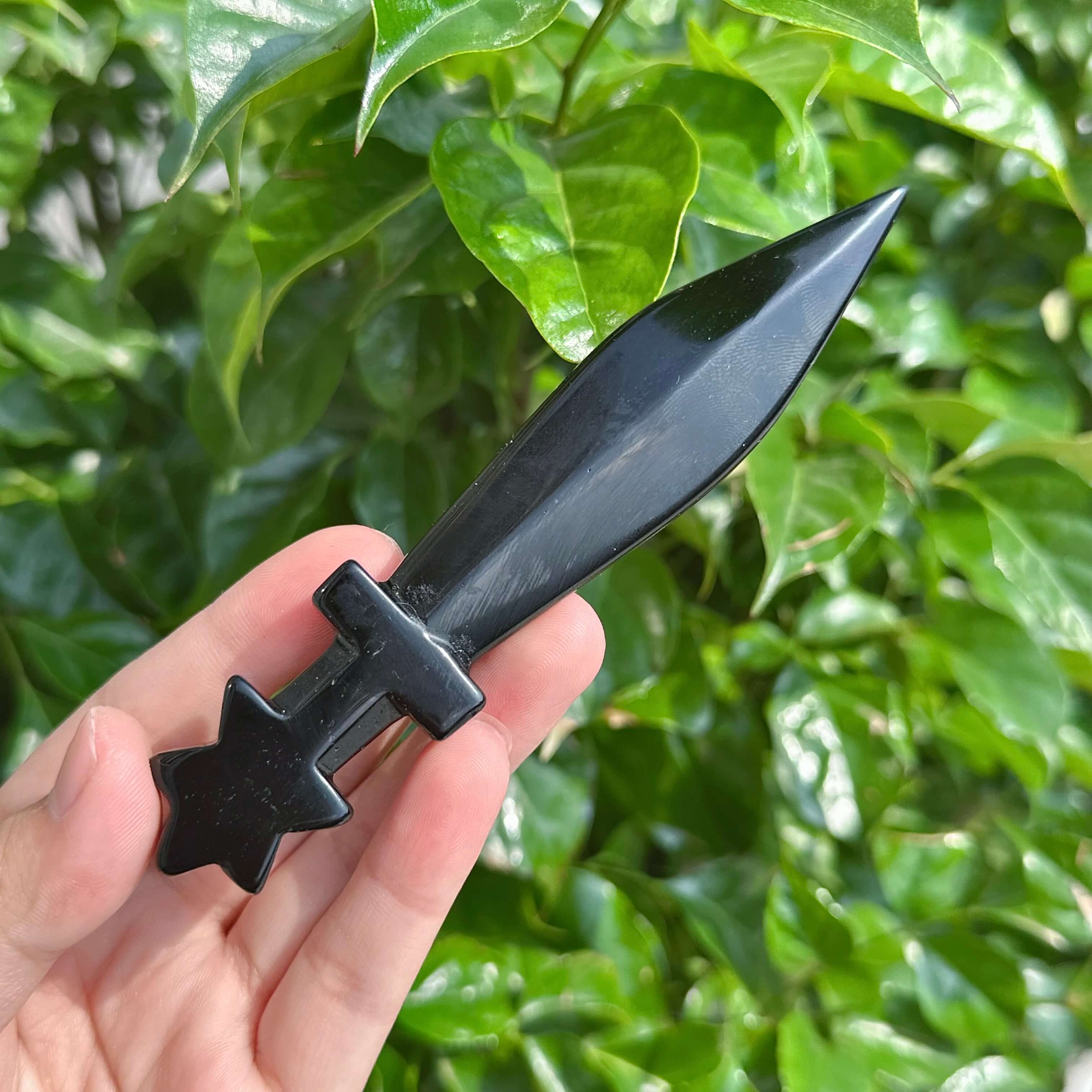 Two Pentagram obsidian swords showcasing the star hilt and sharp obsidian blade.