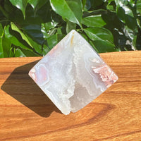 Close-up of Pink Agate Cube showcasing natural pink hues and detailed crystal formations.