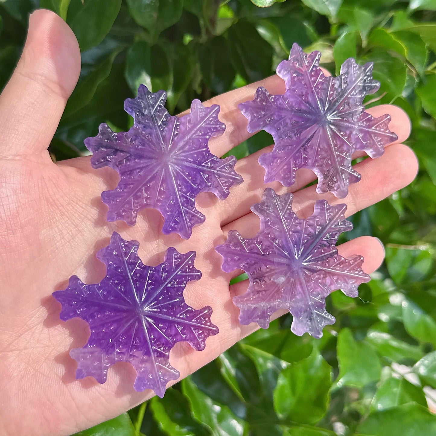 Beautiful Purple Fluorite Snowflake carving showcasing crystal elegance.