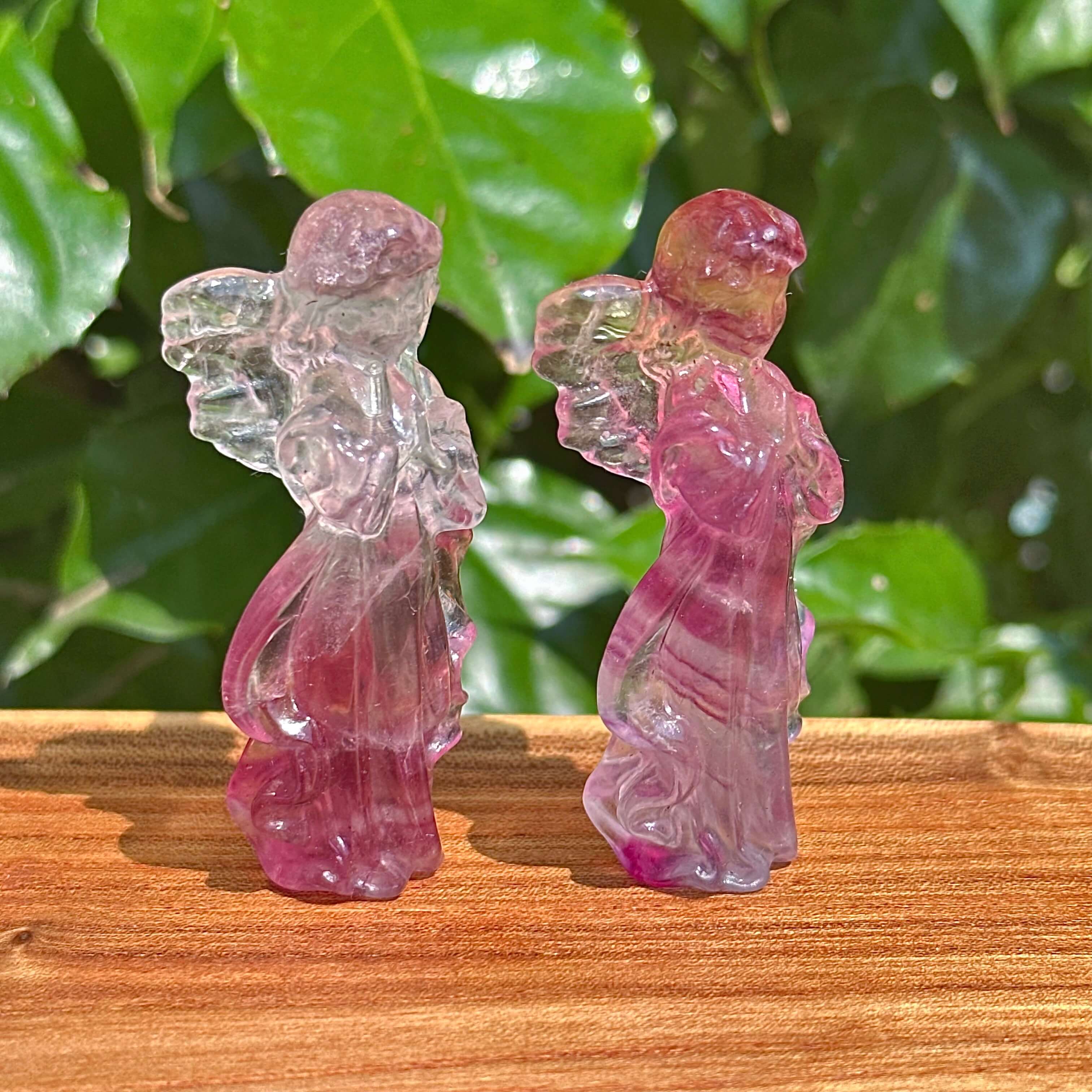 Rainbow Fluorite angel carving with delicate transparent wings, capturing a peaceful and graceful figure