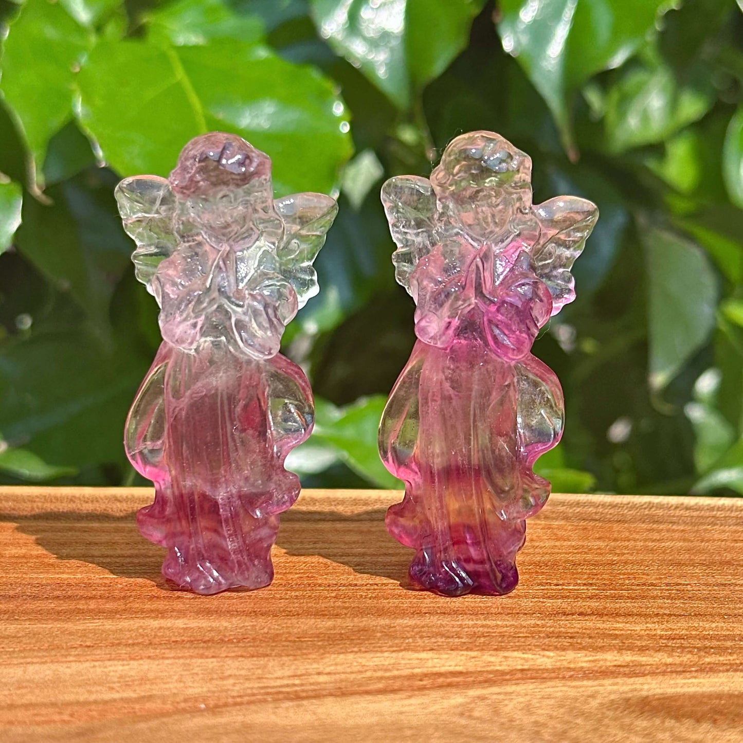 Side view of the Rainbow Fluorite angel carving, showing the beautifully detailed angelic figure