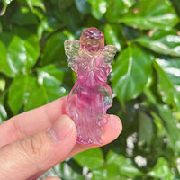 Rainbow Fluorite angel carving in a gentle pose, emphasizing the bright purple and clear wings