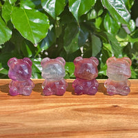 Rainbow Fluorite Bear Carving with intricate details and vibrant color transitions.