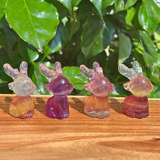 Rainbow Fluorite Deer Carving – A beautifully crafted crystal deer figurine with translucent details and colorful hues.