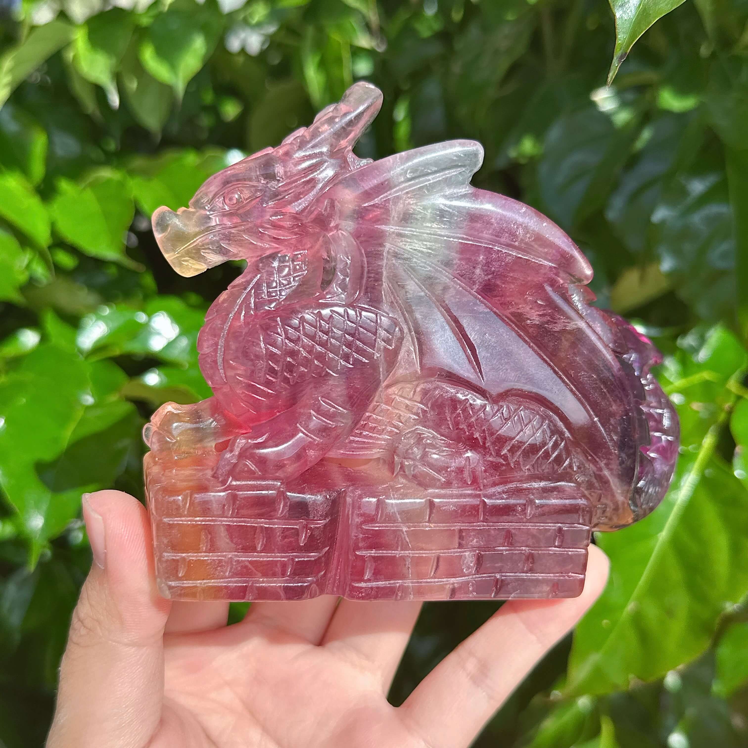 Close-up view of the Rainbow Fluorite Dragon Carving, showcasing its beautiful craftsmanship and colors.