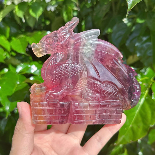 Close-up view of the Rainbow Fluorite Dragon Carving, showcasing its beautiful craftsmanship and colors.