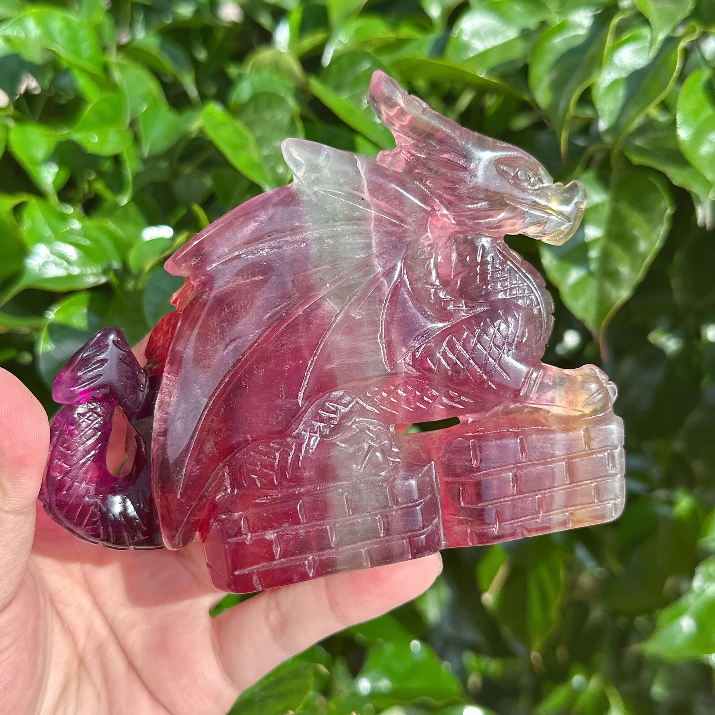 Rainbow Fluorite Dragon Carving highlighting the rich hues and fine details of the sculpture.